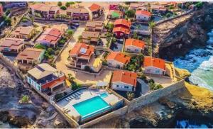 an aerial view of a house with a swimming pool at Casita Solemar direkt am Atlantik in Calheta Do Maio