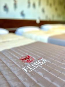 Postel nebo postele na pokoji v ubytování Hotel Fenice