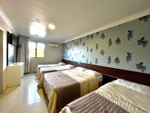 Postel nebo postele na pokoji v ubytování Hotel Fenice