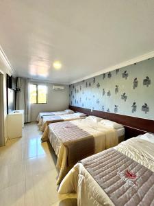 Postel nebo postele na pokoji v ubytování Hotel Fenice