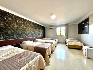 Postel nebo postele na pokoji v ubytování Hotel Fenice