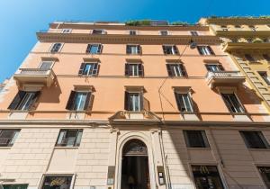 a large building with an arch in front of it at Boutique Apartment 29 in Rome