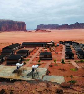 a compound in the middle of a desert at desert splendor camp & jeep tours in Wadi Rum