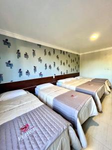 Postel nebo postele na pokoji v ubytování Hotel Fenice