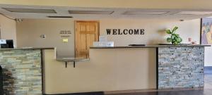 a lobby with a welcome sign on the wall at Hotel Inn Santa Fe in Santa Fe