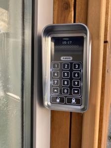 a cell phone is attached to a door at Moderne EG 2-Zimmer Wohnung in Trier