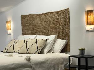 a bedroom with a large bed with white pillows at La Morica in Gelsa