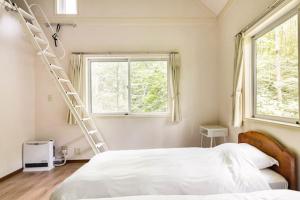 מיטה או מיטות בחדר ב-Green Lodge - Vacation STAY 28389v