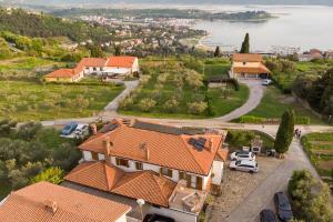 an aerial view of a house with orange roofs at Olive Hill Apartment in Portorož