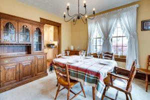 a kitchen and dining room with a table and chairs at Pennsylvania Abode Near Little League World Series in Williamsport