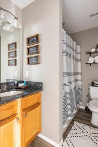 a bathroom with a sink and a toilet at 3BR Branson Condo PrimeLocation! in Branson