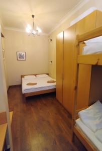 a small room with two bunk beds in it at Belokorichi in Kyiv