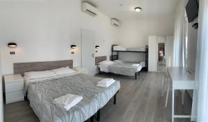 Postel nebo postele na pokoji v ubytování Hotel Laika