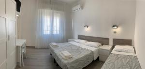 Krevet ili kreveti u jedinici u okviru objekta Hotel Laika