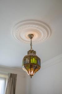 a chandelier hanging from a ceiling at Casa Sweet In in Vilvoorde