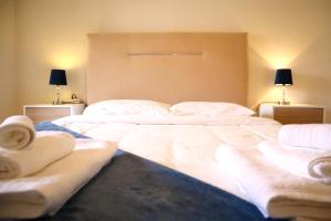 Кровать или кровати в номере Apartamento O Limoeiro, Barreiro - Lisboa