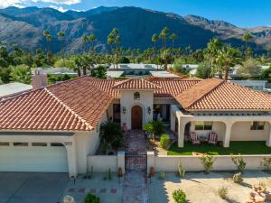 an aerial view of a house with mountains in the background at Casa Del Lobo in Palm Springs