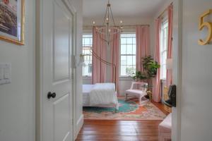 a bedroom with a bed and a window at Sugar's INN Room #5 in Galveston