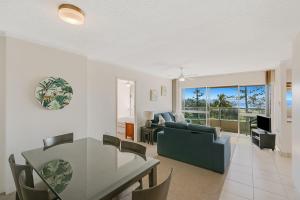 a living room with a table and a couch at Kooringal Unit 10 in Gold Coast