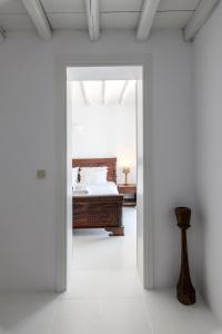 A bed or beds in a room at Salty Blè