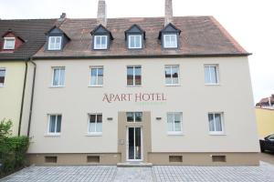 a large white building with the words rent hotel at Aparthotel Gartenstadt in Bamberg