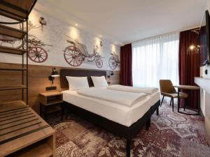 Postel nebo postele na pokoji v ubytování ibis Styles Coburg