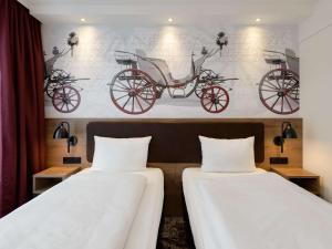 Postel nebo postele na pokoji v ubytování ibis Styles Coburg