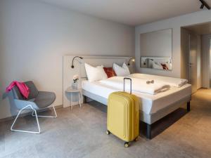 Letto o letti in una camera di ibis Styles Graz Messe