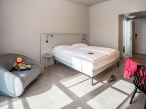 Letto o letti in una camera di ibis Styles Graz Messe