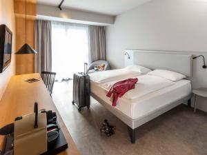 Letto o letti in una camera di ibis Styles Graz Messe