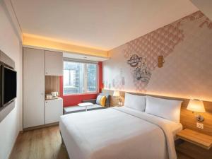 Postel nebo postele na pokoji v ubytování ibis Mumbai Vikhroli - An Accor Brand
