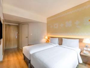 Postel nebo postele na pokoji v ubytování ibis Mumbai Vikhroli - An Accor Brand
