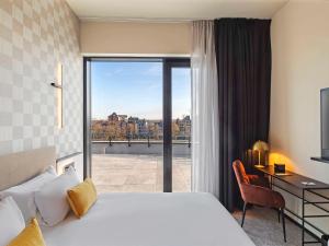 Mercure Namur Hotel客房内的一张或多张床位
