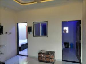 Postel nebo postele na pokoji v ubytování PATEL HOME STAY