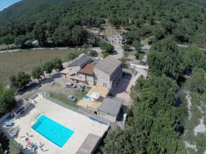 an aerial view of a house with a swimming pool at In Tavignanu in Sortipiani