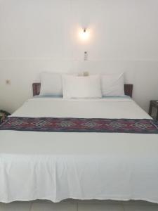 Ein Bett oder Betten in einem Zimmer der Unterkunft Bukit Garden Gili Trawangan