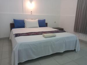 Ein Bett oder Betten in einem Zimmer der Unterkunft Bukit Garden Gili Trawangan