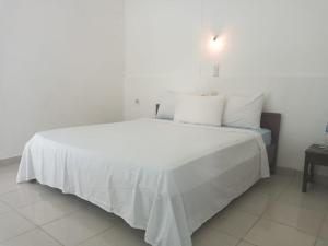 Ein Bett oder Betten in einem Zimmer der Unterkunft Bukit Garden Gili Trawangan