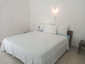 Ein Bett oder Betten in einem Zimmer der Unterkunft Bukit Garden Gili Trawangan