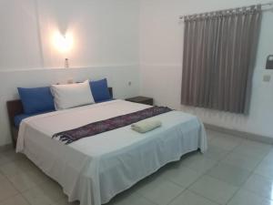 Ein Bett oder Betten in einem Zimmer der Unterkunft Bukit Garden Gili Trawangan