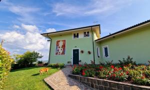 a dog standing in front of a house at CLAVES'ANNA in Carrù