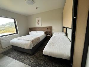 Postel nebo postele na pokoji v ubytování Swagman Chalet
