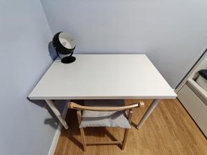 a white desk with a chair and a lamp at Joshua Court Single Room in Stoke on Trent