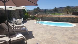 Bazén v ubytovaní ANFI TOPAZ VILLA TAURO GOLF & BEACH 3 bedrooms 4 bathrooms private pool alebo v jeho blízkosti