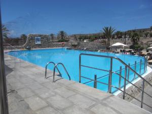 Bazén v ubytovaní ANFI TOPAZ VILLA TAURO GOLF & BEACH 3 bedrooms 4 bathrooms private pool alebo v jeho blízkosti