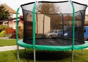 a trampoline in a yard with at Bungalovy Natura in Trávnica