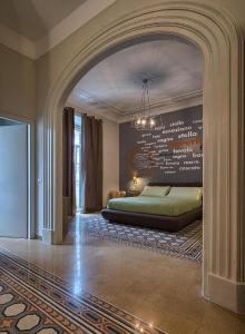 an archway in a bedroom with a bed in it at The Pope's Window in Rome