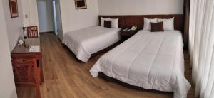 Postel nebo postele na pokoji v ubytování Faraona Grand Hotel
