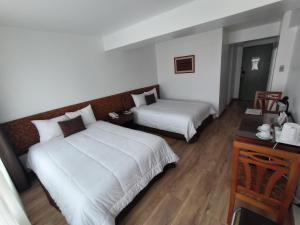 Postel nebo postele na pokoji v ubytování Faraona Grand Hotel