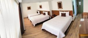 Postel nebo postele na pokoji v ubytování Faraona Grand Hotel